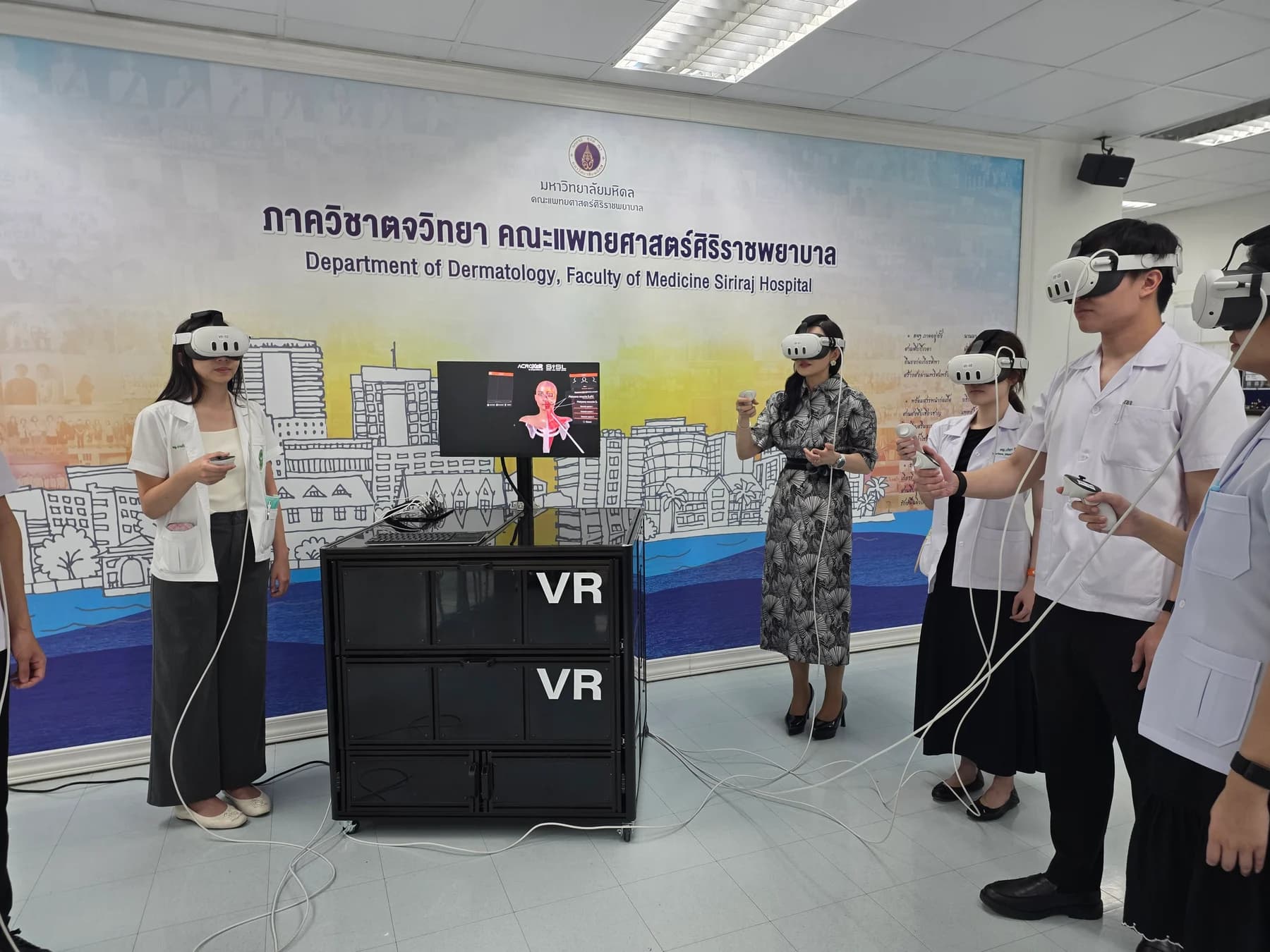 A group of learners using FAesthetics VR headsets and controllers at Siriraj Hospital